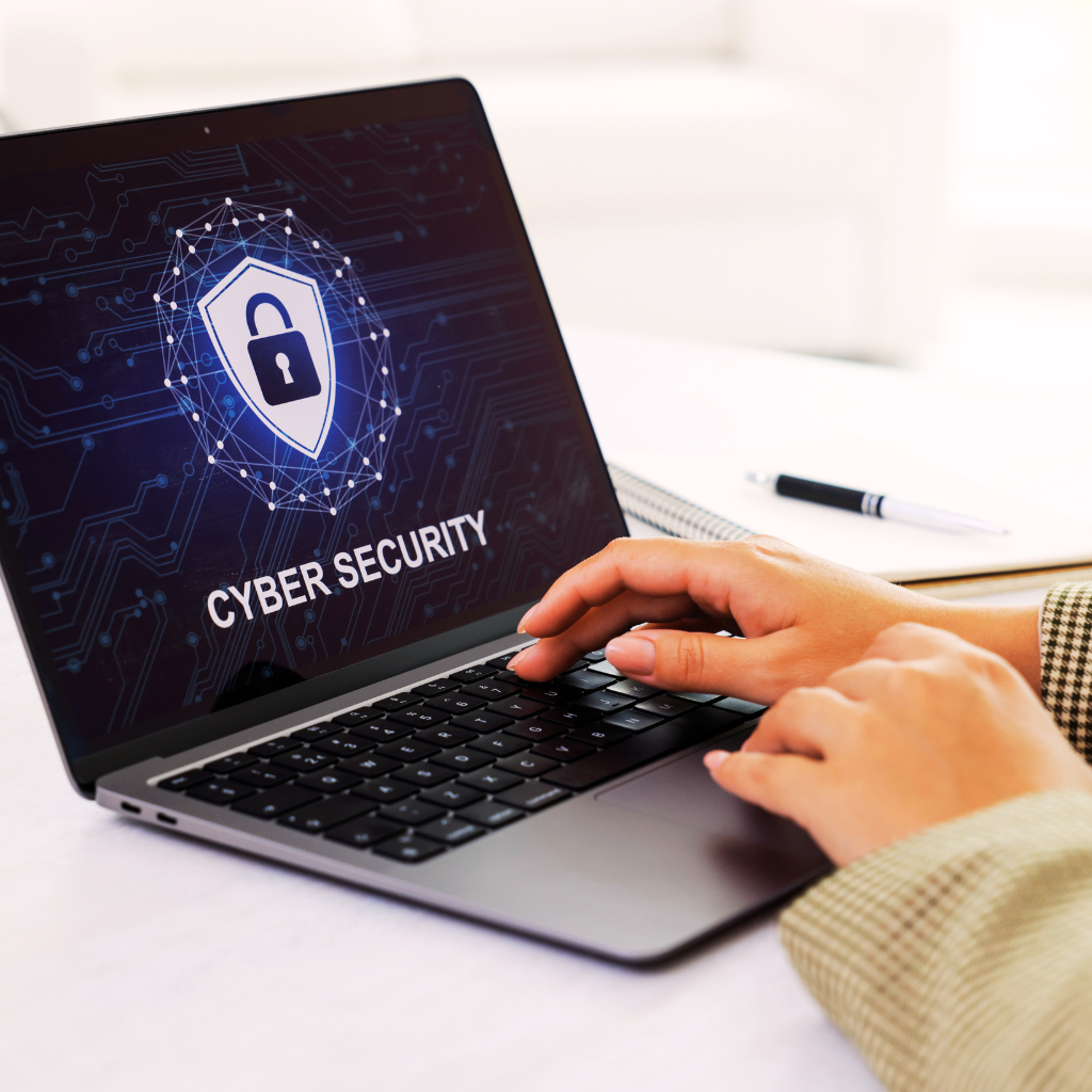 Laptop showing cyber security shield for business insurance in New Jersey – The Barclay Group